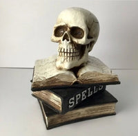 
              Light Up resin skull on a stack of spell books
            